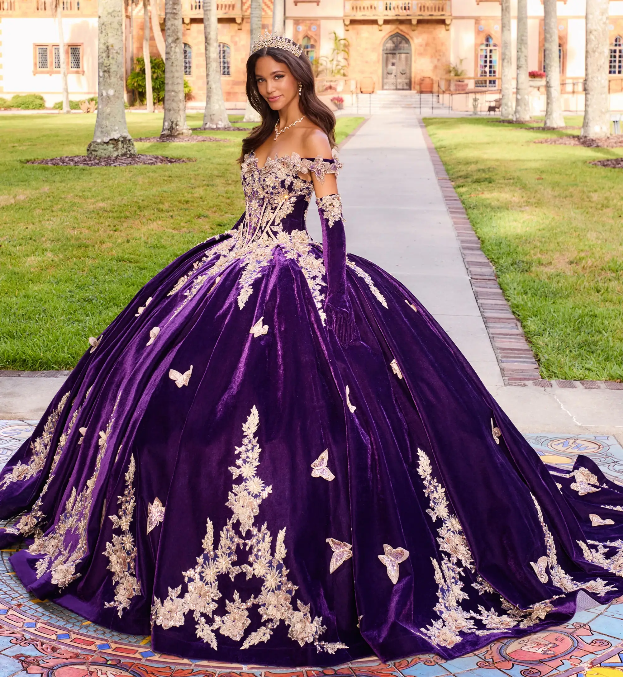 model is wearing a dark purple quince dress