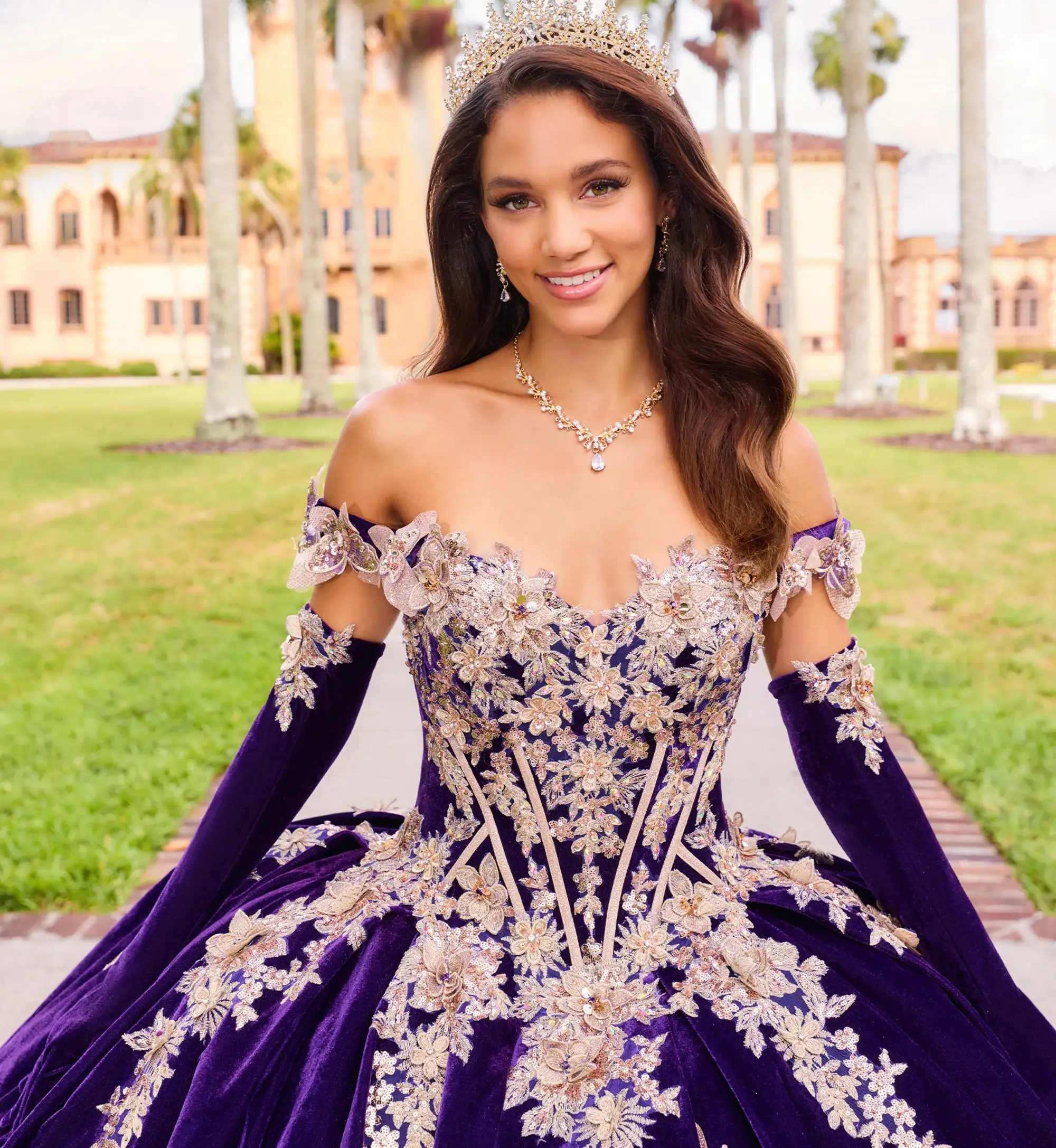 model is wearing a dark purple quince dress
