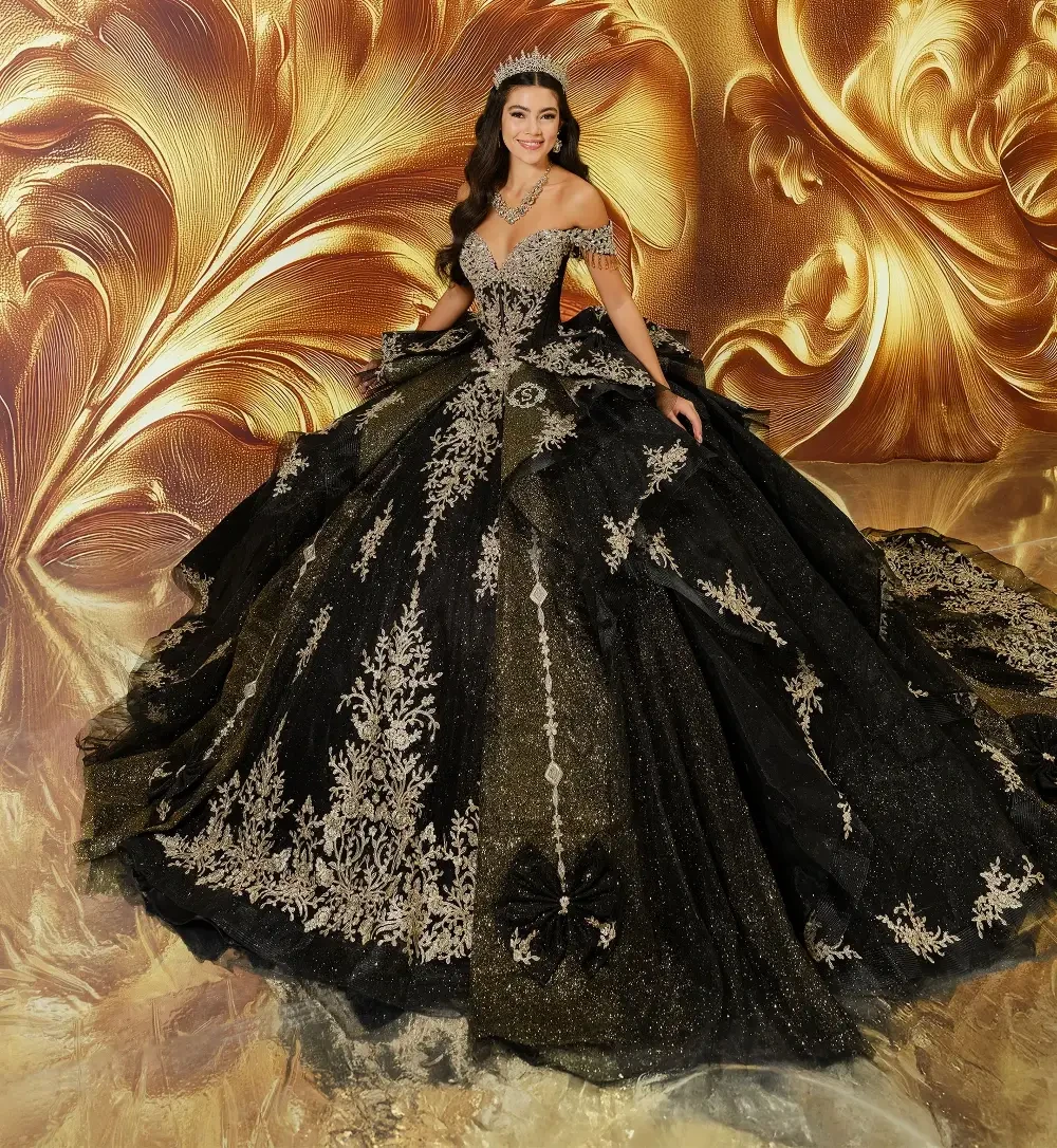 model is wearing a black quince gown