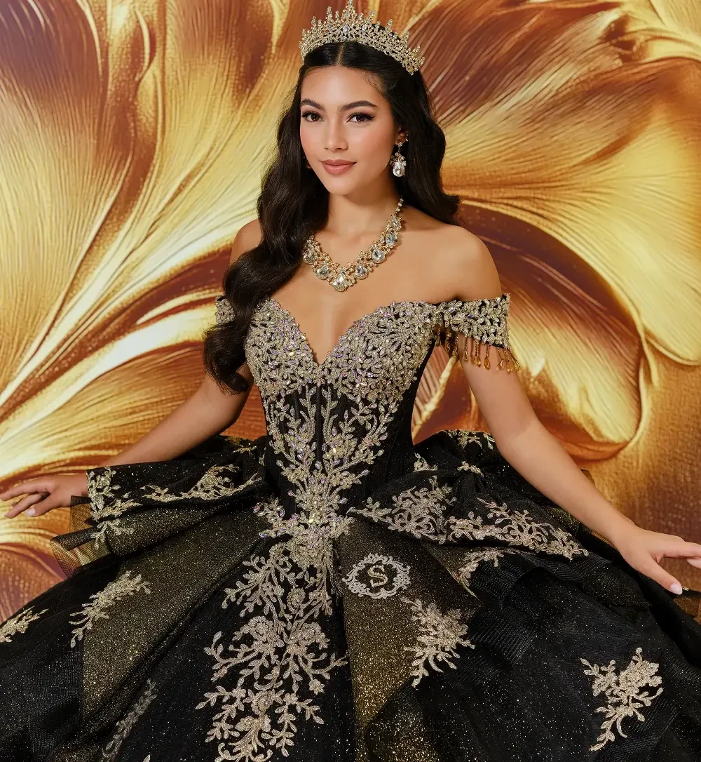 model is wearing a black quince gown