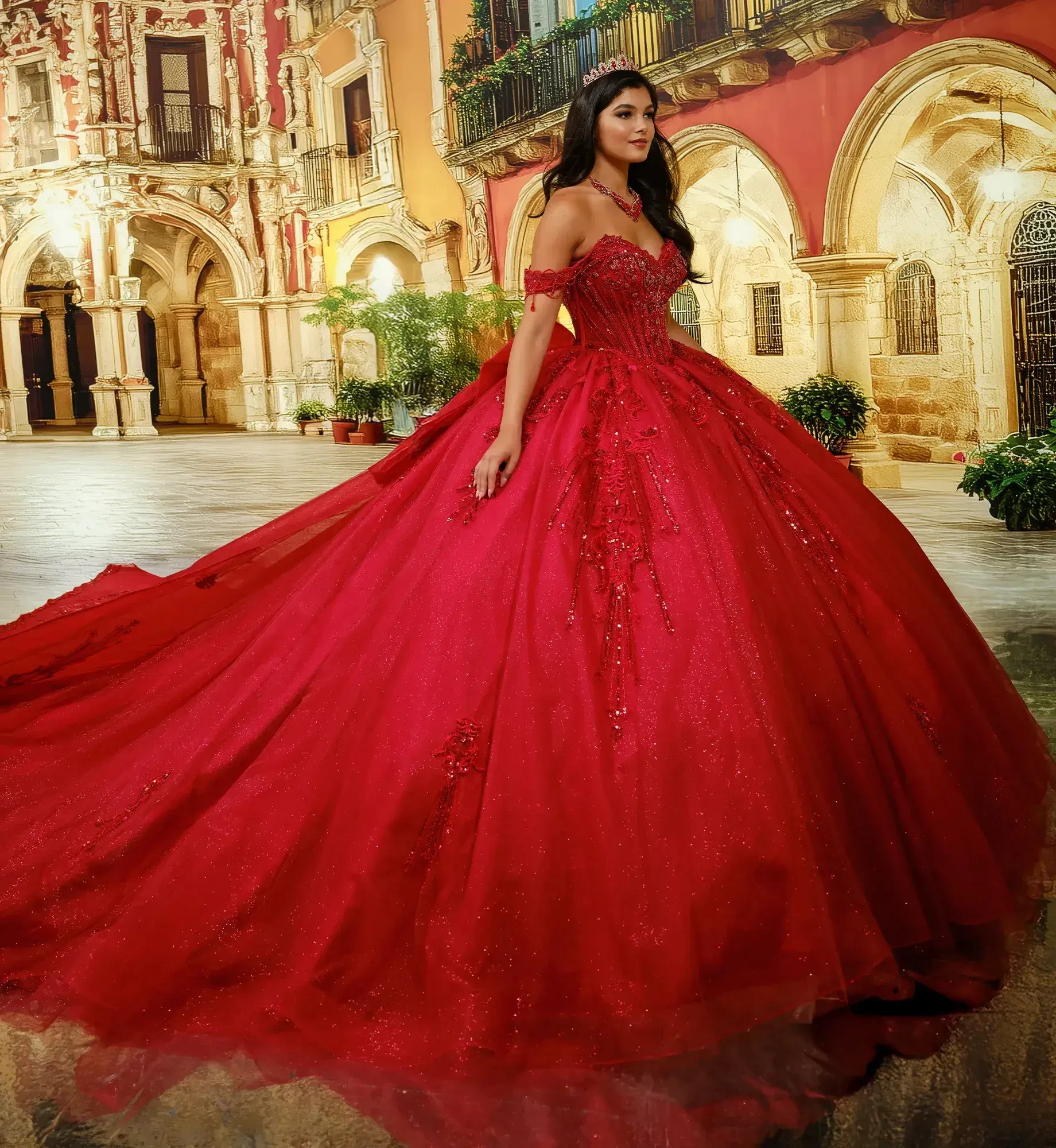 Una mujer con un deslumbrante vestido de gala rojo, con intrincados adornos, de pie en un patio bellamente dise&ntilde;ado.