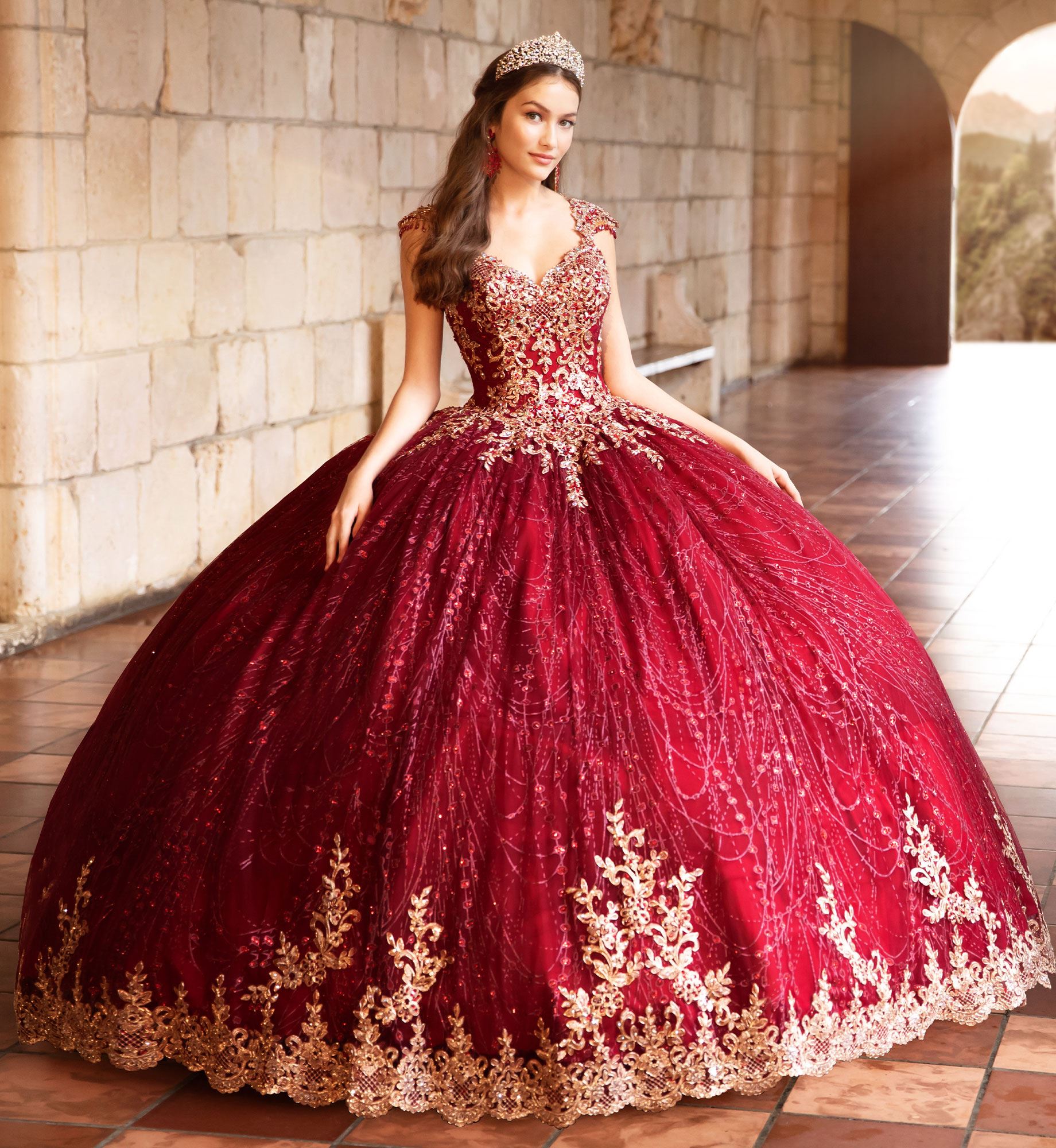 Brunette model in wine red and gold quinceañera dress