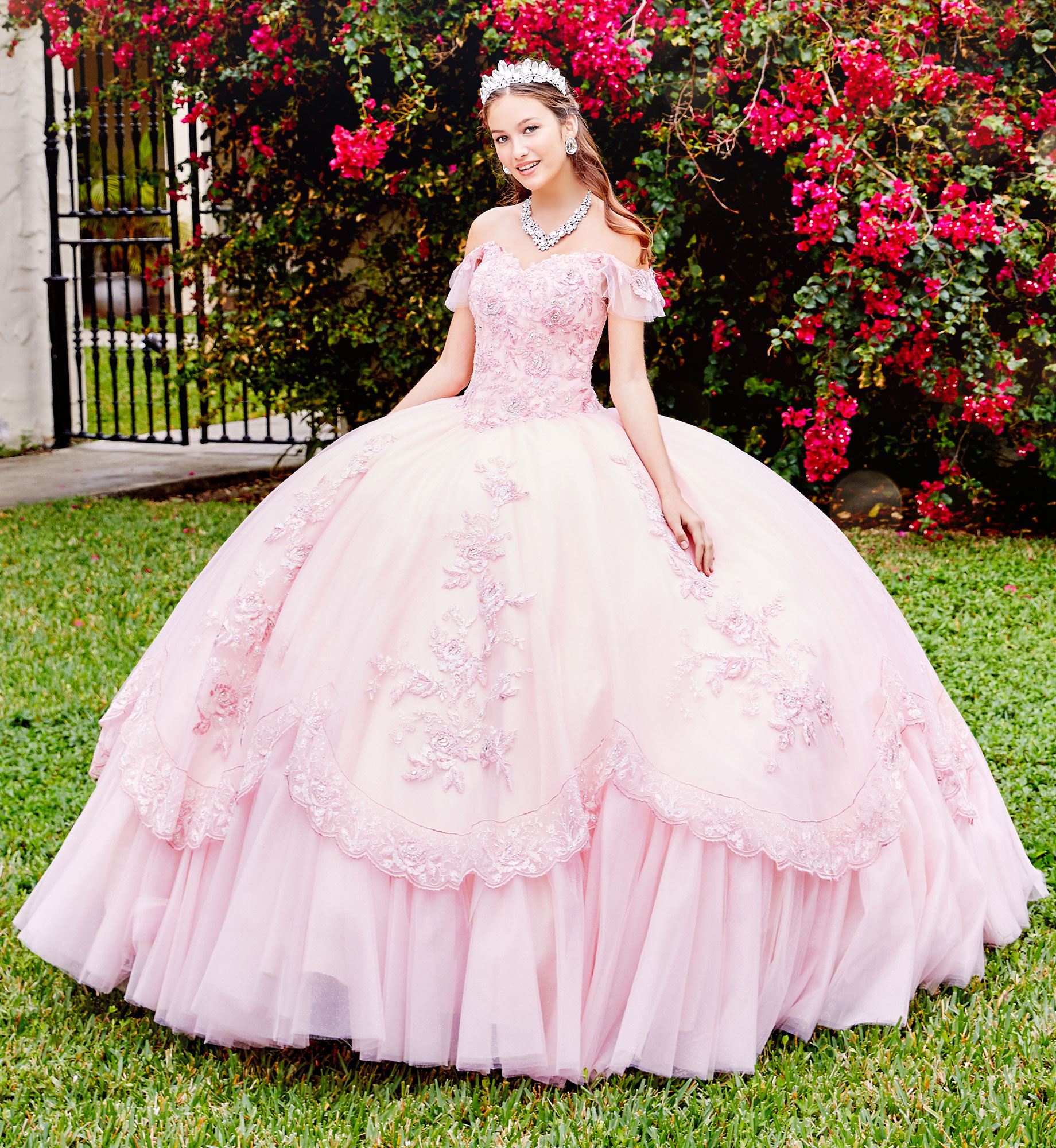 Brunette model in pale pink quinceañera dress