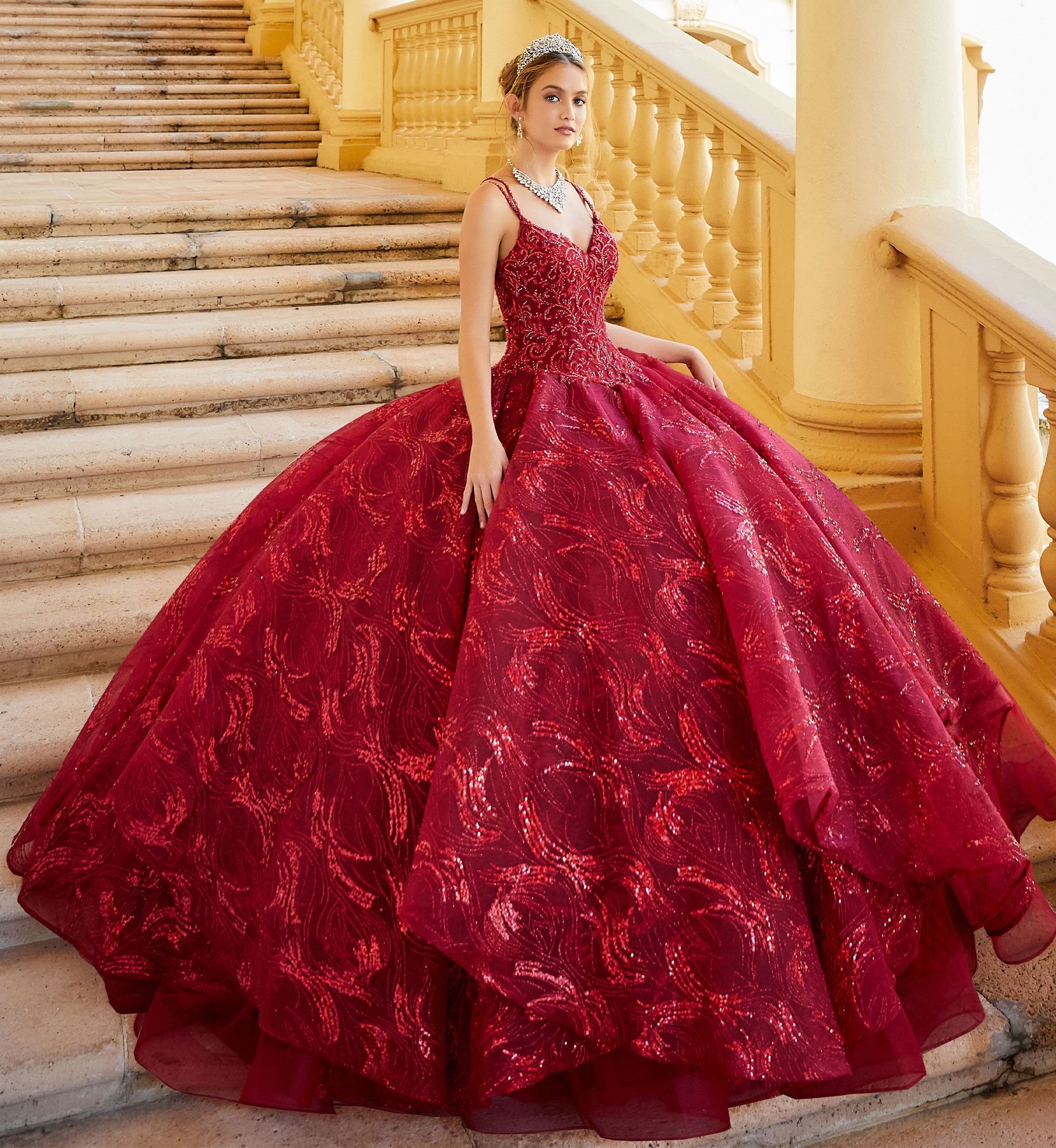 Brunette model in wine red quinceañera dress
