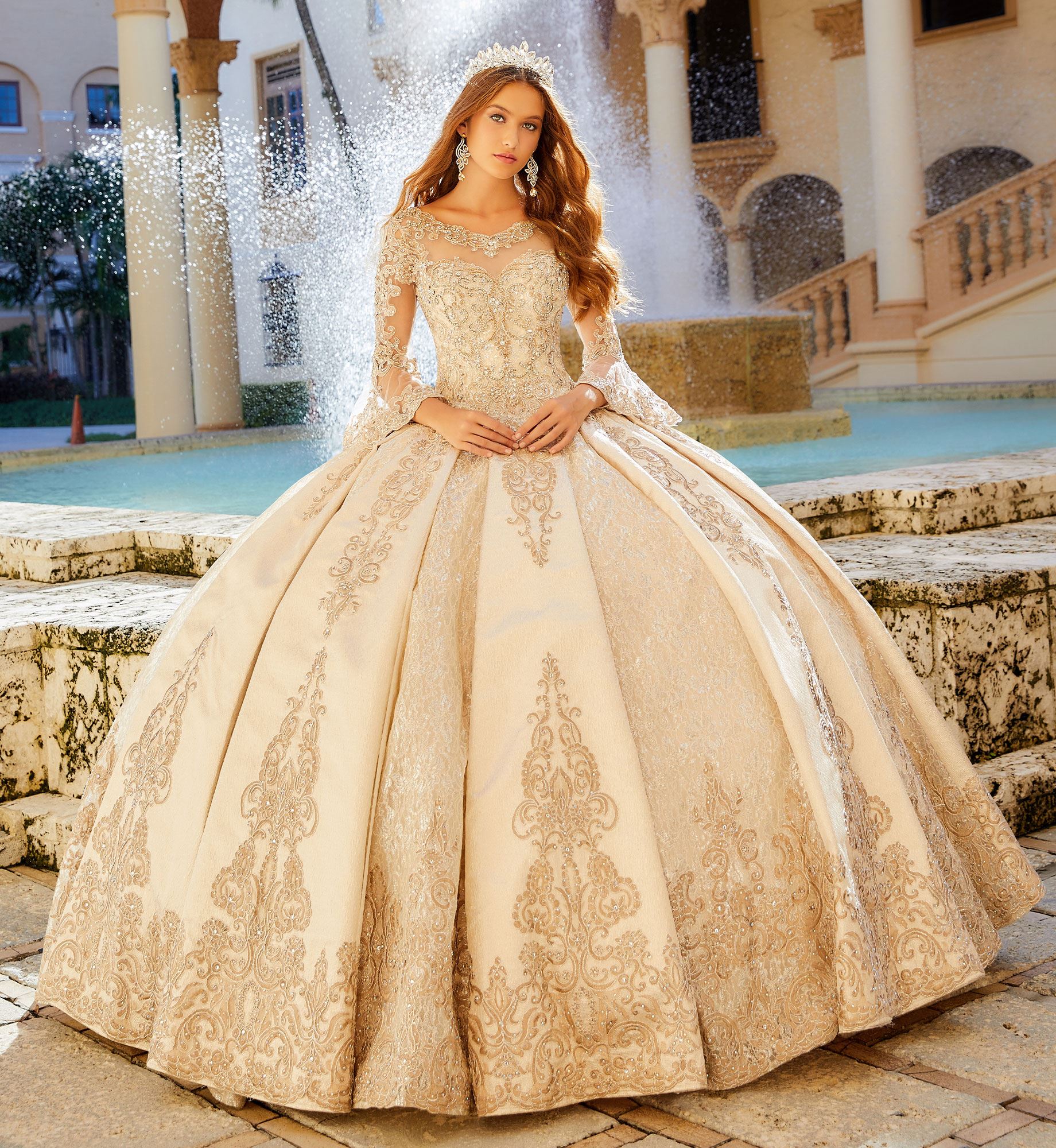 Brunette model in gold quinceañera dress with long sleeves