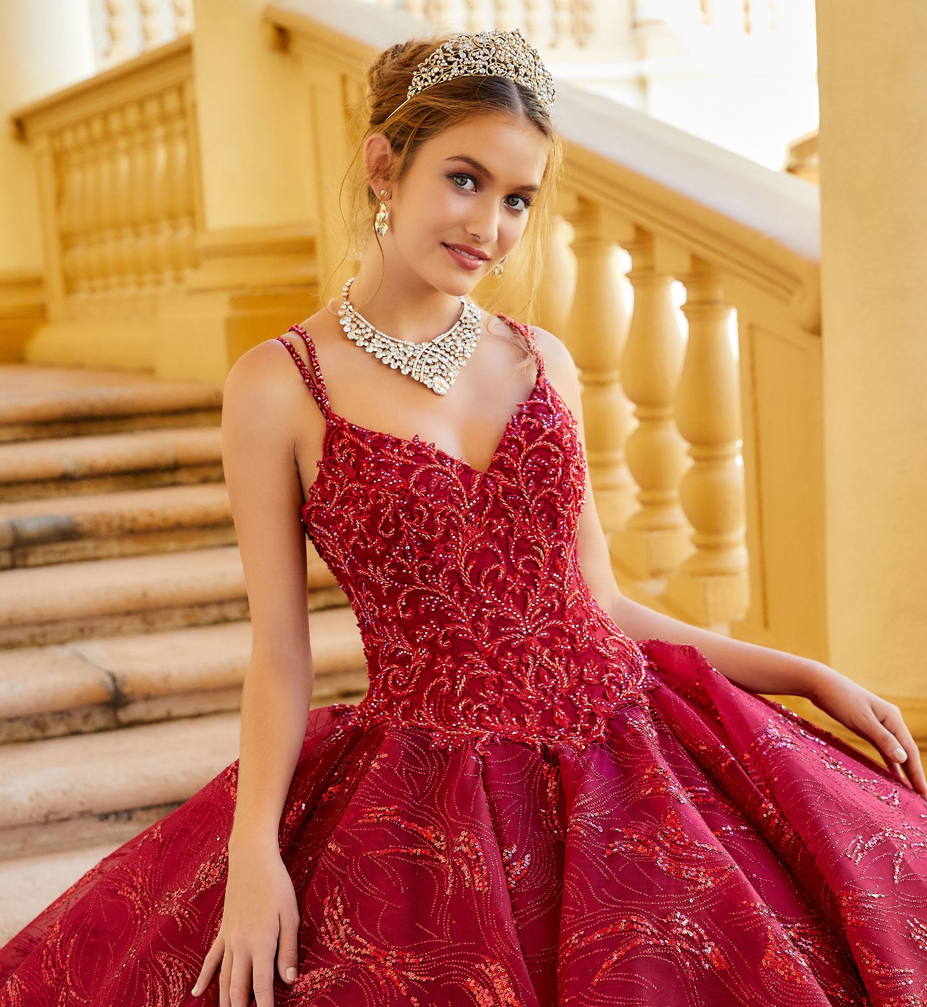 Brunette model in spaghetti strap red quinceañera dress